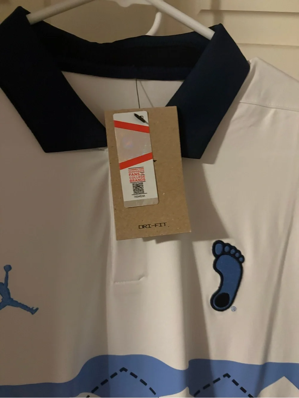 Jordan White UNC Polo with Light Blue Argyle Chest and Navy Trim